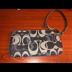 a small blue and cute coach wristlet!